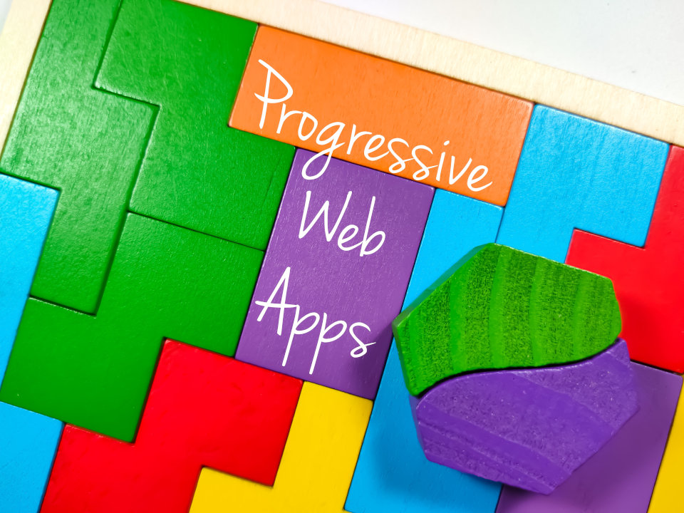 A colourful jigsaw with Progressive Web Apps written on it.
