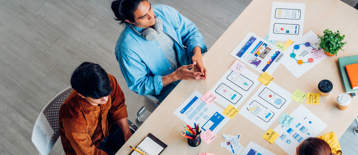 A team looking at UX wireframes